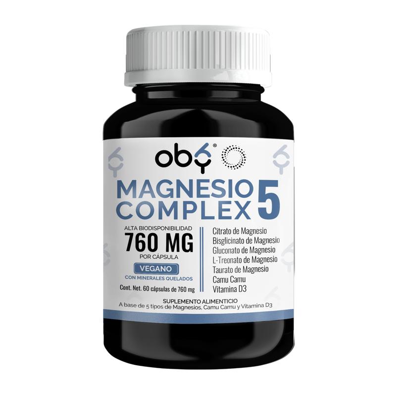 Frasco negro de Magnesio Complex 5 OBY sobre mármol blanco con hojas naturales